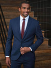 Model wearing Brook Taverner Pegasus Slim Fit Jacket in Navy