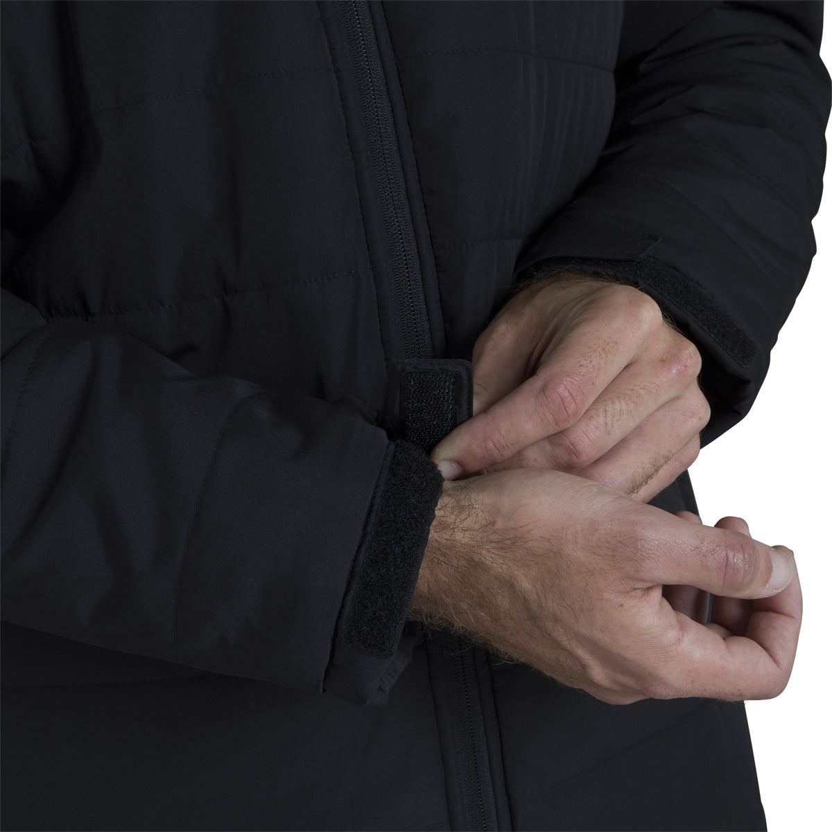 Close up of model highlighting sleeve cuff adjustment on theCanterbury Club Subs Jacket in Black