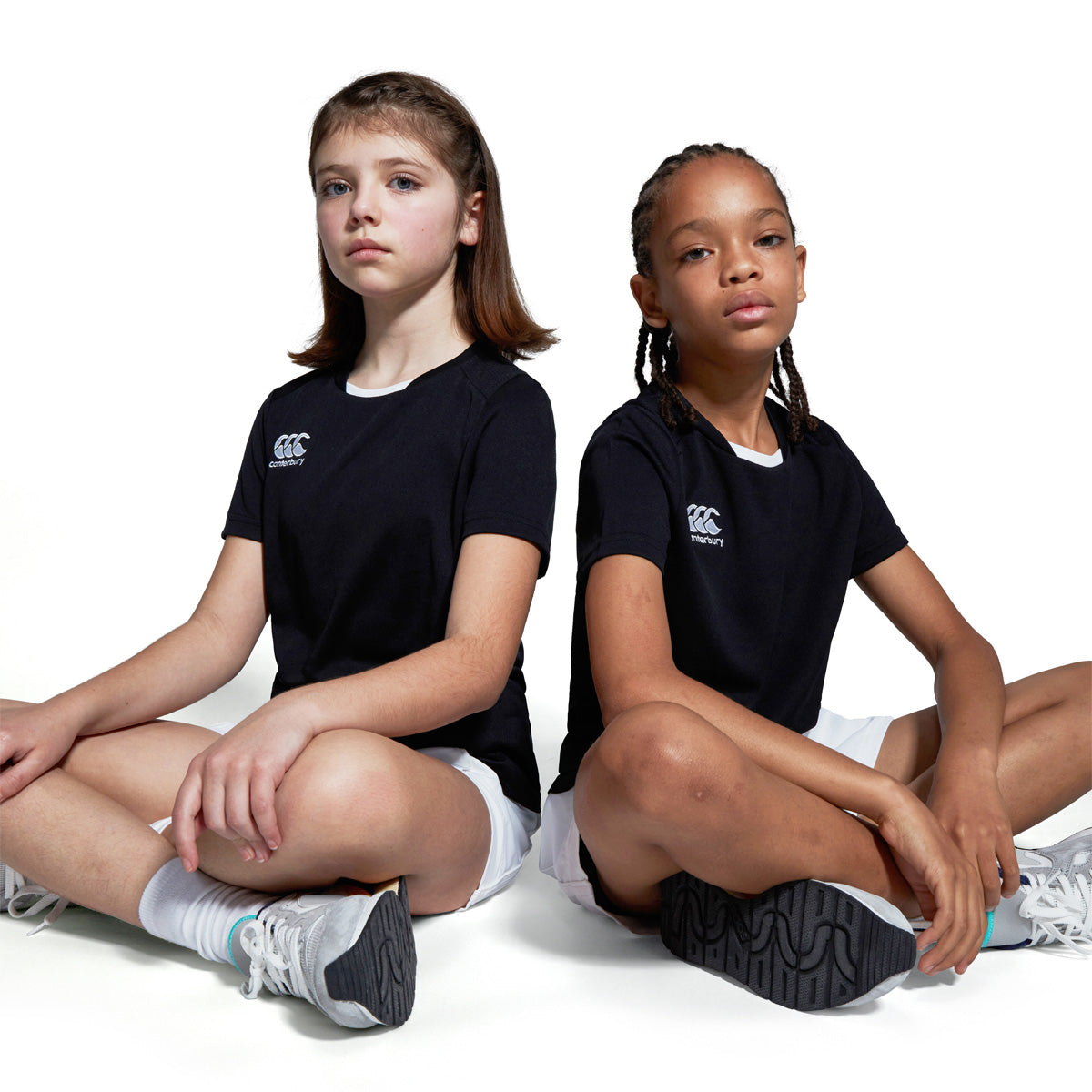 Photo of models wearing the Canterbury Club Dry Tee Junior in Black