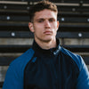 Photo of model wearing Canterbury Elite 1/4 Zip Top in Navy, shoulder & chest