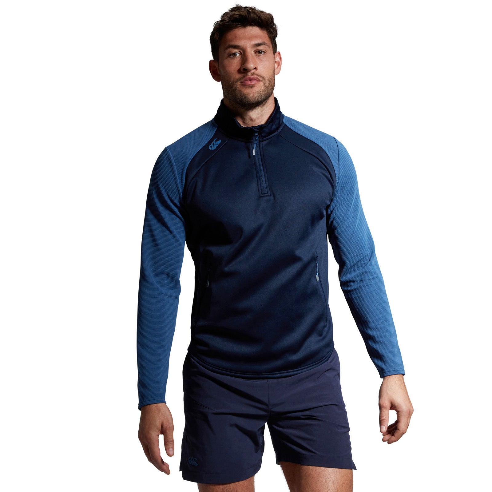 Photo of model wearing Canterbury Elite 1/4 Zip Top in Navy, front