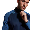 Photo of model wearing Canterbury Elite 1/4 Zip Top in Navy, shoulder & chest detail