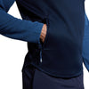 Photo of model wearing Canterbury Elite 1/4 Zip Top in Navy, waist & pocket detail