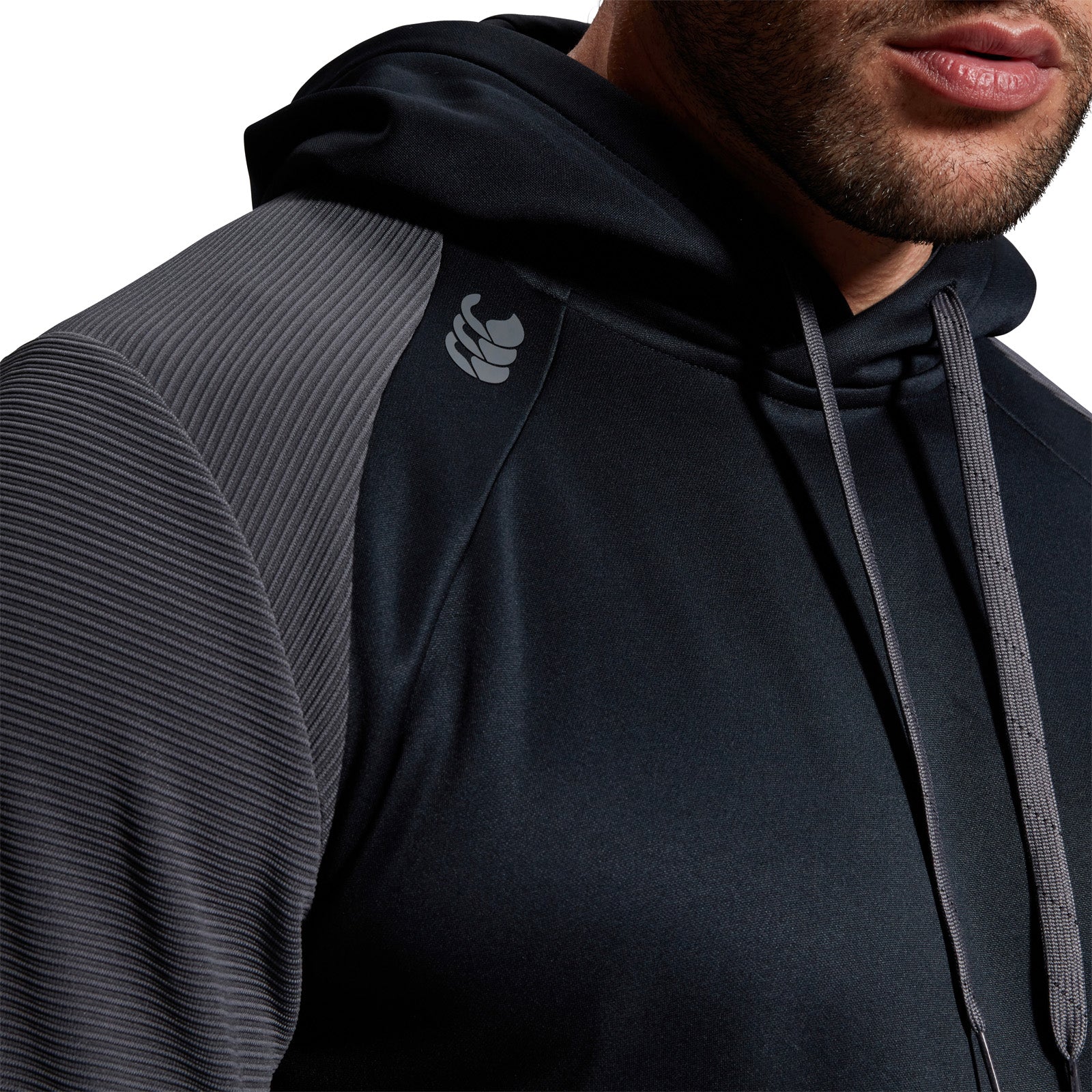 Photo of model wearing the Canterbury Elite Training Hoody Black, chest and shoulder close up