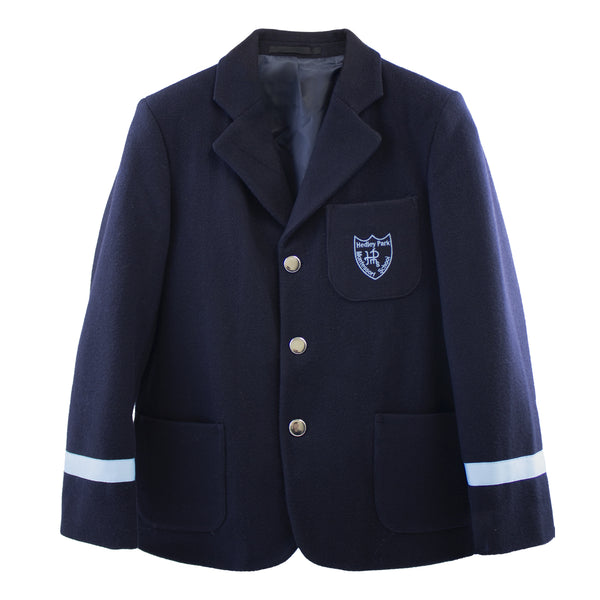 A photo of the Hedley Park Navy Blazer, with sky blue band on each lowe sleeve. Blazer embroidered with Hedley Park School Crest