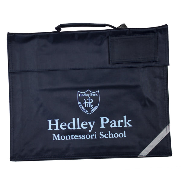 A photo of the Hedley Park Book Satchel in Navy, with printed school crest on front