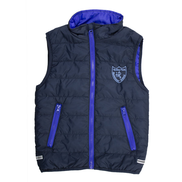 A photo of the Hedley Park Gilet in Navy/Royal, with embroidered School Crest on left chest.