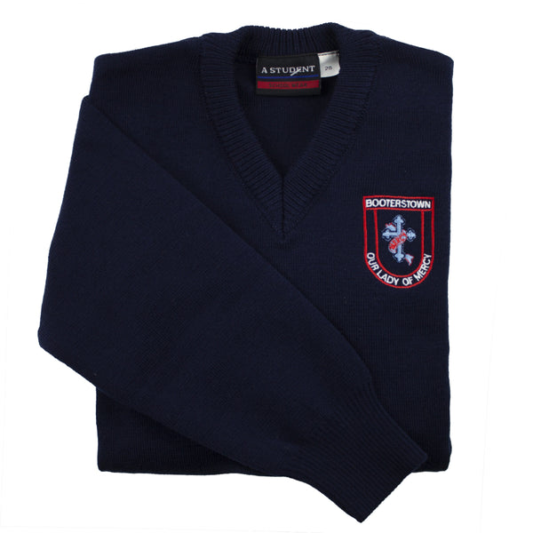 A photo of the Our Lady Of Mercy Booterstown Pullover in Navy with embroidered School crest on left chest. Sleeve detail also highlighted in shot