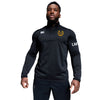 A photo a model wearing the Seapoint Mens 1/4 Zip Midlayer in Black with embroidered club crest