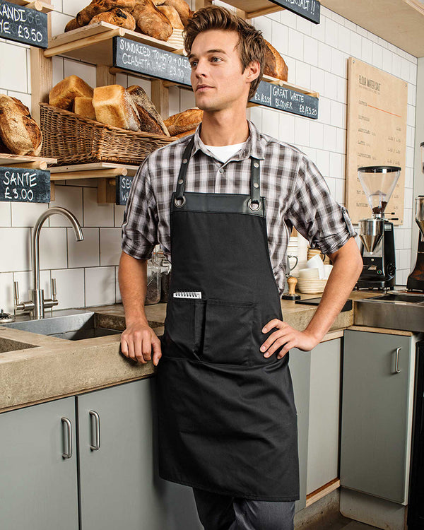 Model wearing the Espresso Bib Apron