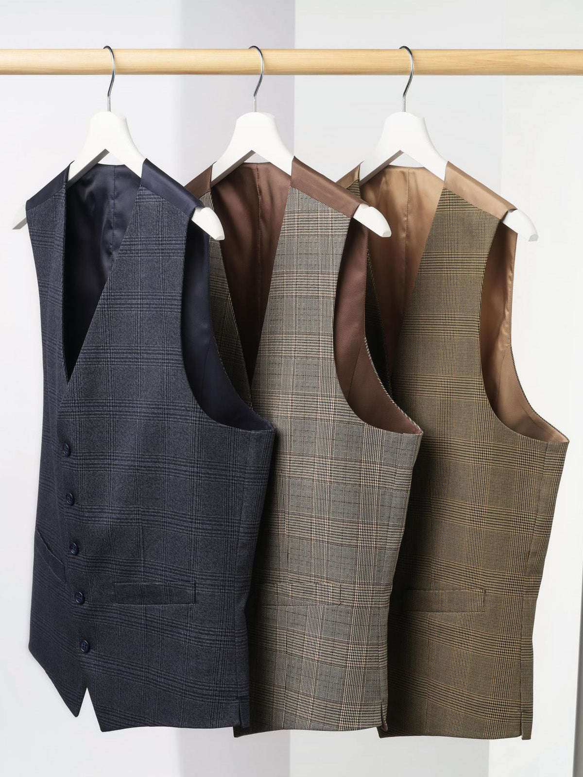 Brook Taverner 'Emilio' waistcoats hung on rail