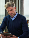 Model wearing Brook Taverner Boston V-neck Jumper in Navy