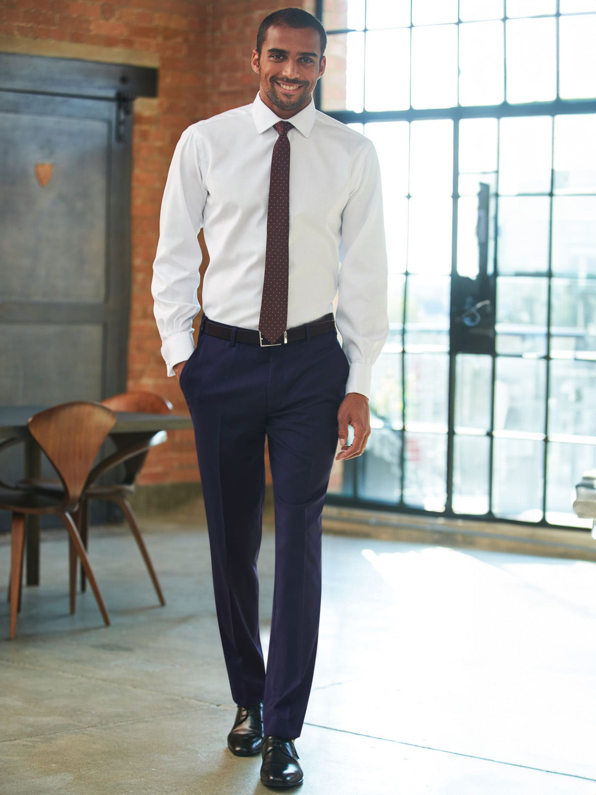 Model wearing Brook Taverner Cassino Slim Fit Trouser in Navy