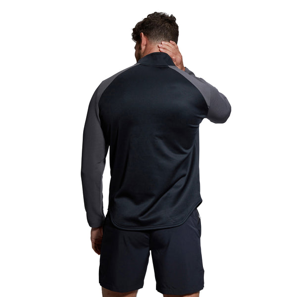 Photo of model wearing Canterbury Elite 1/4 Zip Top in Black from the rear