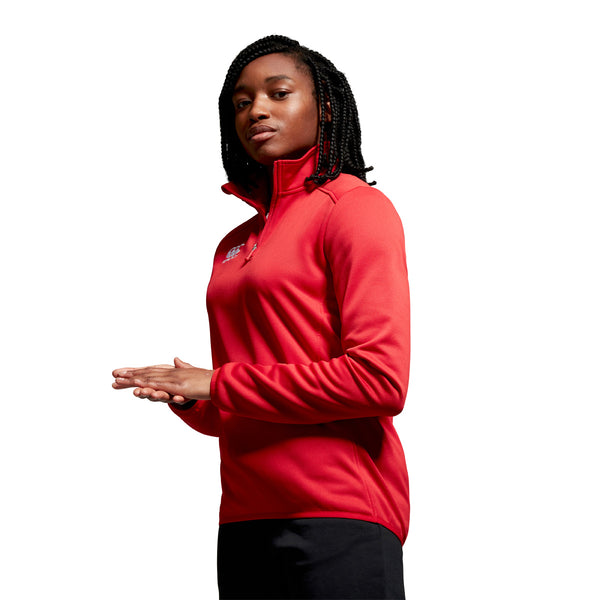 Photo of model wearing Canterbury Womens Club 1/4 Zip Mid Layer Training Top in Red, side view