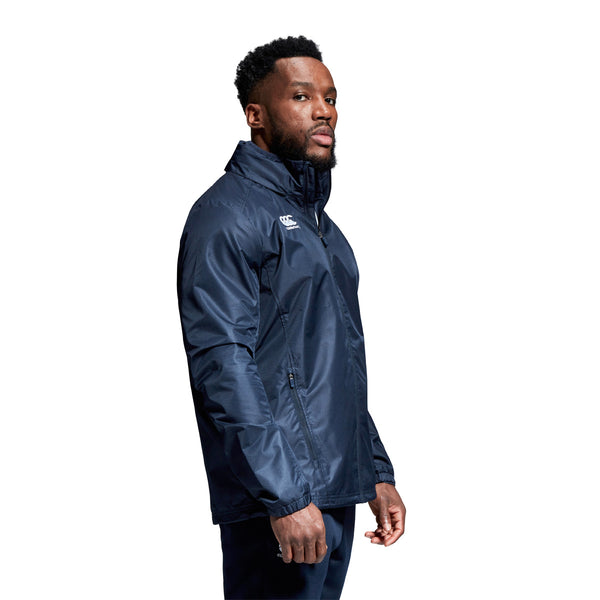 A photo of a model wearing the Canterbury Club Vaposhield Full Zip Rain Jacket in Navy, side view