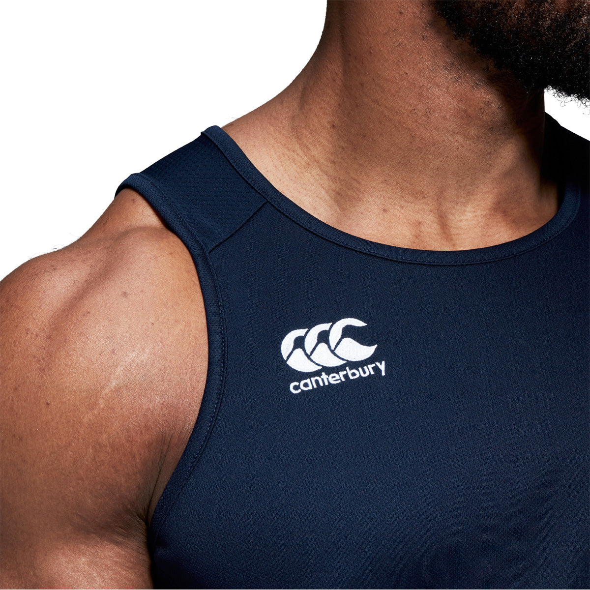 Front shoulder photo of model wearing Canterbury Club Dry Singlet in Navy