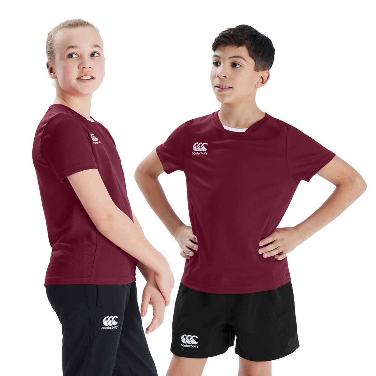 Photo of models wearing the Canterbury Club Dry Tee Junior in Maroon