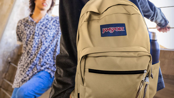 School backpacks, image of student wearing a Jansport Campus Backpack